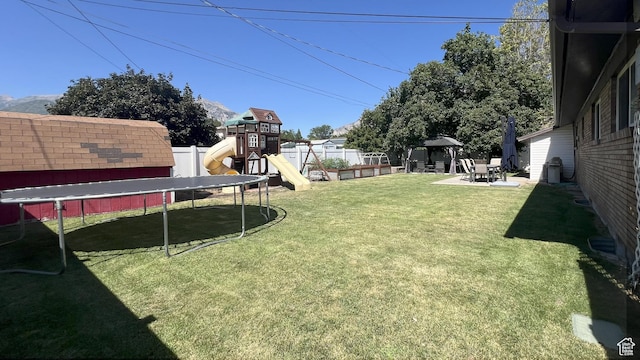 663 E 485 S, Orem, UT 84097 - fenced backyard featuring a trampoline, a gazebo, a playground, and a patio