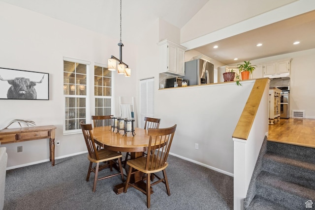 145 S 300 E, Kaysville, UT 84037 - dining area featuring dark carpet, recessed lighting, stairs, and high vaulted ceiling