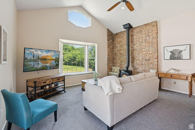 145 S 300 E, Kaysville, UT 84037 - living room with a wood stove, ceiling fan, carpet floors, healthy amount of natural light, and high vaulted ceiling