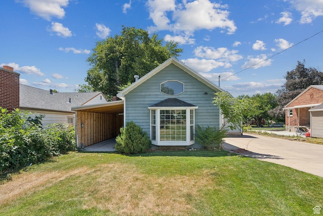 145 S 300 E, Kaysville, UT 84037 - rear view of property with a lawn and driveway