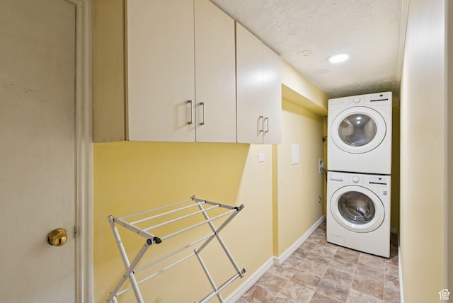 145 S 300 E, Kaysville, UT 84037 - washroom featuring stacked washer and clothes dryer and cabinet space