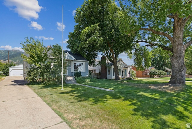 145 S 300 E, Kaysville, UT 84037 - view of front of home with a front yard and a garage