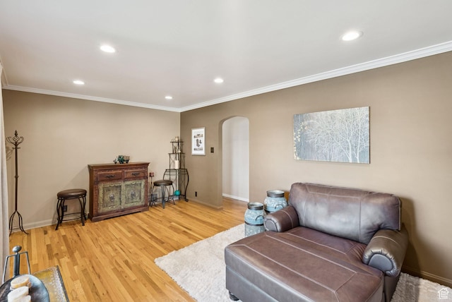 145 S 300 E, Kaysville, UT 84037 - living room featuring arched walkways, ornamental molding, recessed lighting, and light wood-style flooring