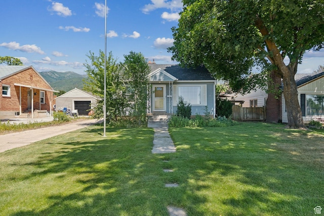 145 S 300 E, Kaysville, UT 84037 - bungalow featuring driveway, brick siding, a detached garage, and a mountain view