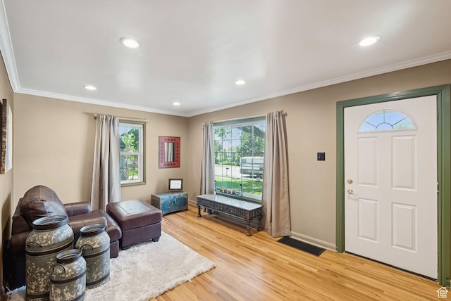 145 S 300 E, Kaysville, UT 84037 - entrance foyer featuring light wood finished floors, ornamental molding, and recessed lighting