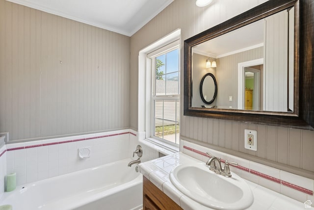 145 S 300 E, Kaysville, UT 84037 - bathroom featuring crown molding, healthy amount of natural light, a garden tub, vanity, and wallpapered walls