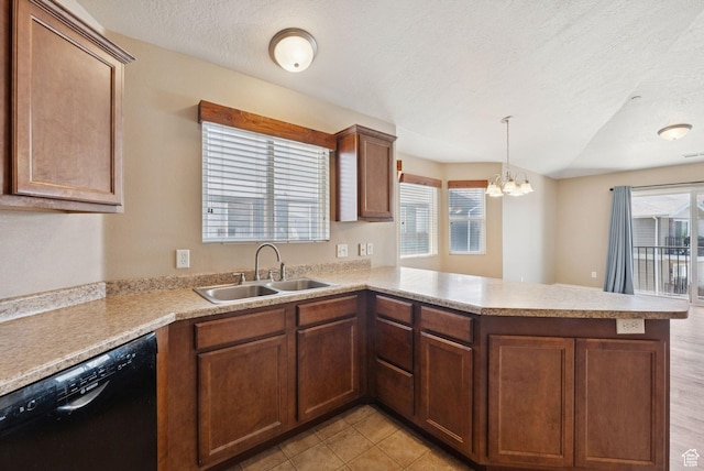 8229 S Resaca Dr Unit D11, Sandy, UT 84070 - kitchen featuring black dishwasher, a peninsula, light countertops, a textured ceiling, and a chandelier