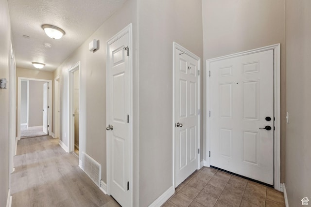 8229 S Resaca Dr Unit D11, Sandy, UT 84070 - corridor with a textured ceiling and baseboards
