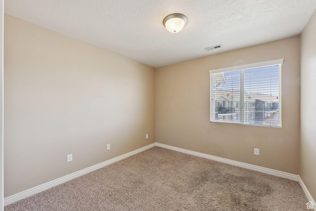 8229 S Resaca Dr Unit D11, Sandy, UT 84070 - carpeted spare room featuring baseboards and a textured ceiling