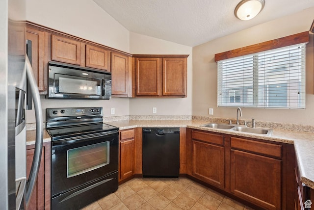 8229 S Resaca Dr Unit D11, Sandy, UT 84070 - kitchen with black appliances, lofted ceiling, brown cabinetry, light countertops, and a textured ceiling