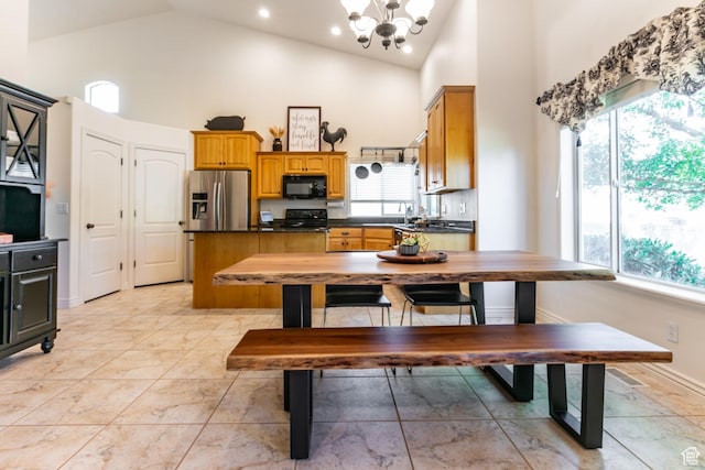 2343 E 1580 S, Spanish Fork, UT 84660 - kitchen with black microwave, dark countertops, high vaulted ceiling, healthy amount of natural light, and range with electric cooktop
