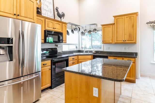 2343 E 1580 S, Spanish Fork, UT 84660 - kitchen with black appliances, a kitchen island, light marble finish flooring, dark stone counters, and a towering ceiling