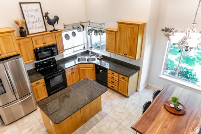 2343 E 1580 S, Spanish Fork, UT 84660 - kitchen with black appliances, a kitchen island, light marble finish flooring, a chandelier, and a towering ceiling