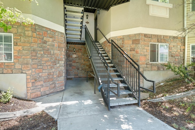 2103 N Aurora Way, Saratoga Springs, UT 84045 - doorway to property featuring stucco siding and stone siding