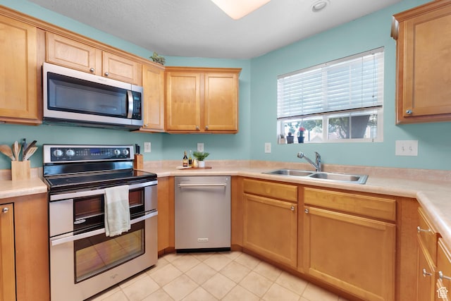 2103 N Aurora Way, Saratoga Springs, UT 84045 - kitchen with appliances with stainless steel finishes, light countertops, and light tile patterned floors