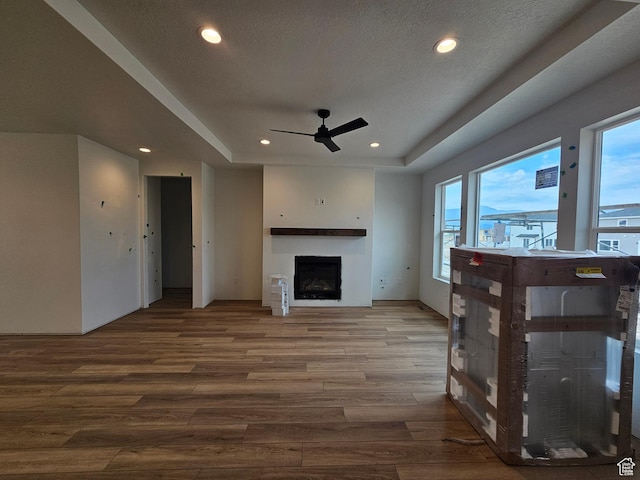1768 S 3875 W Unit 227, Taylor, UT 84401 - living room featuring a ceiling fan, wood finished floors, plenty of natural light, a fireplace, and recessed lighting