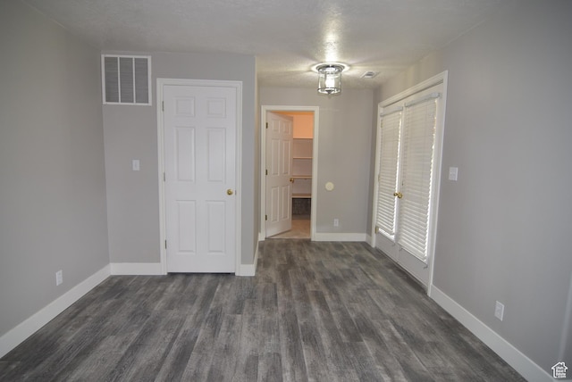 107 W High Sierra Dr, Elk Ridge, UT 84651 - unfurnished bedroom featuring dark wood-style flooring and a closet
