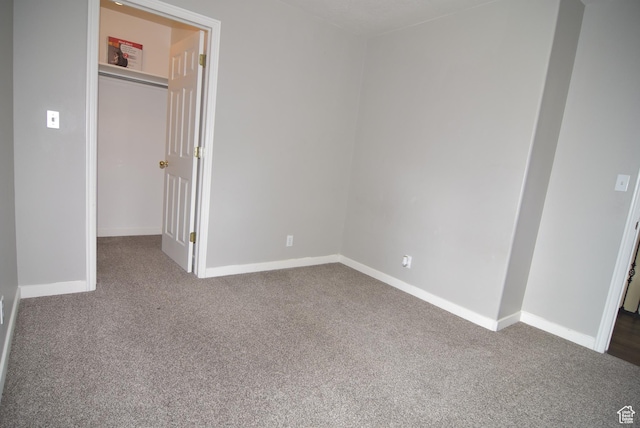 107 W High Sierra Dr, Elk Ridge, UT 84651 - unfurnished bedroom with dark colored carpet and a walk in closet