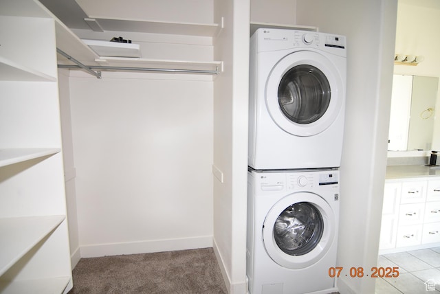 107 W High Sierra Dr, Elk Ridge, UT 84651 - laundry room featuring stacked washer / drying machine and light colored carpet