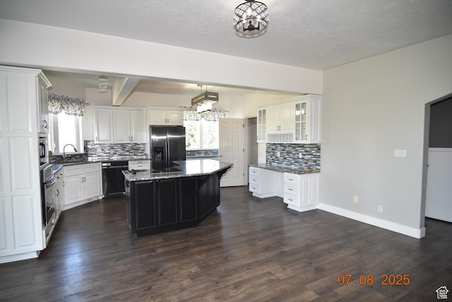 107 W High Sierra Dr, Elk Ridge, UT 84651 - kitchen with fridge with ice dispenser, dishwashing machine, tasteful backsplash, dark stone counters, and glass insert cabinets