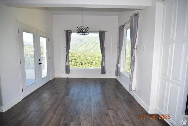 107 W High Sierra Dr, Elk Ridge, UT 84651 - unfurnished dining area featuring dark wood-type flooring, a chandelier, and french doors