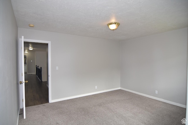 107 W High Sierra Dr, Elk Ridge, UT 84651 - carpeted spare room with a textured ceiling and a smoke detector