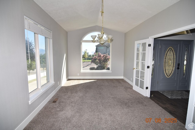 107 W High Sierra Dr, Elk Ridge, UT 84651 - carpeted foyer entrance with vaulted ceiling and a chandelier