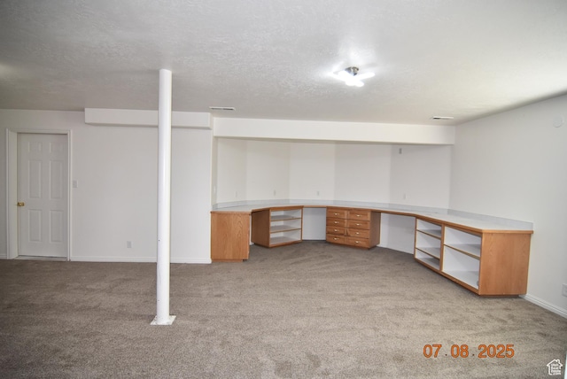 107 W High Sierra Dr, Elk Ridge, UT 84651 - finished below grade area with light carpet, built in desk, and a textured ceiling