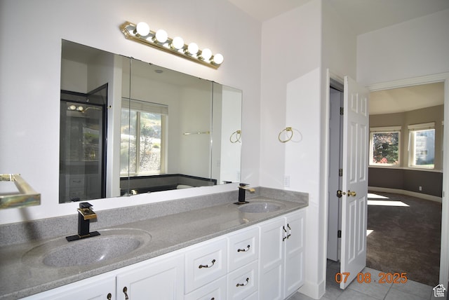 107 W High Sierra Dr, Elk Ridge, UT 84651 - bathroom featuring double vanity, healthy amount of natural light, tile patterned flooring, and an enclosed shower