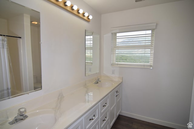 107 W High Sierra Dr, Elk Ridge, UT 84651 - full bathroom featuring double vanity and wood finished floors