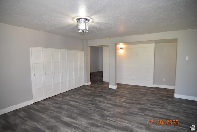 107 W High Sierra Dr, Elk Ridge, UT 84651 - unfurnished bedroom with dark wood-type flooring and a textured ceiling