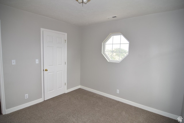 107 W High Sierra Dr, Elk Ridge, UT 84651 - spare room featuring dark carpet and baseboards