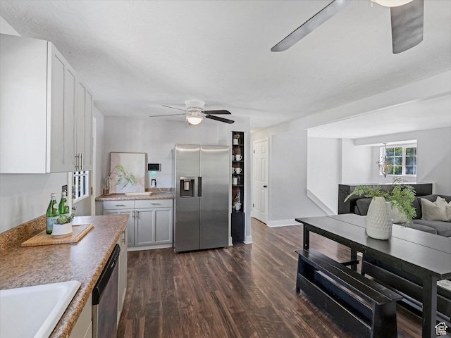 9457 S Poppy Ln, Sandy, UT 84094 - kitchen with appliances with stainless steel finishes, a ceiling fan, dark wood finished floors, open floor plan, and white cabinetry