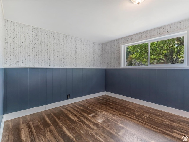 9457 S Poppy Ln, Sandy, UT 84094 - empty room with a wainscoted wall and dark wood-style flooring