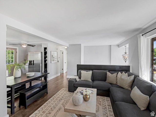 9457 S Poppy Ln, Sandy, UT 84094 - living area featuring dark wood-style flooring, a chandelier, and ceiling fan