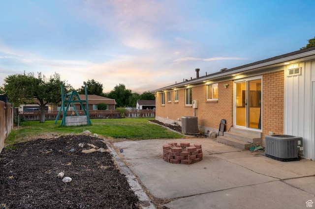 3558 S Chippewa Rd, West Valley City, UT 84120 - view of yard featuring entry steps, a patio area, a playground, and an outdoor fire pit