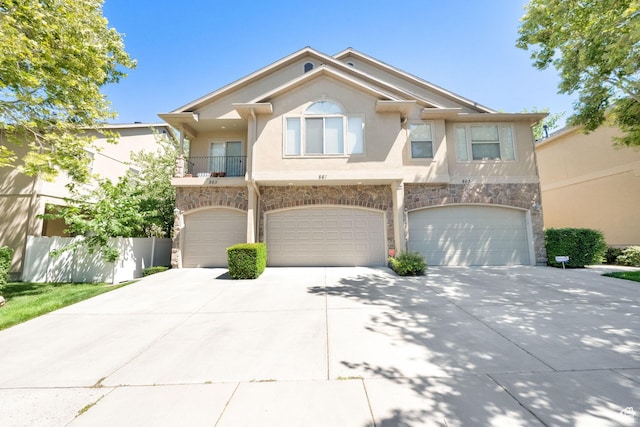 861 E Red Sage Ln, Murray, UT 84107 - multi unit property featuring stone siding, driveway, stucco siding, and a garage