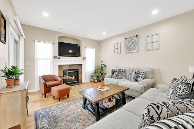 861 E Red Sage Ln, Murray, UT 84107 - living area with plenty of natural light, wood finished floors, a tile fireplace, and recessed lighting