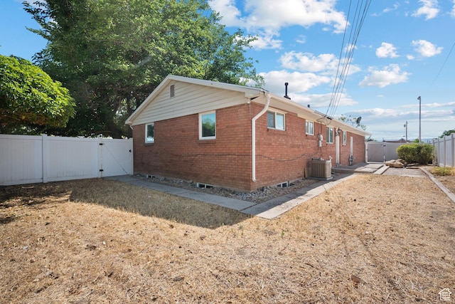 251 E 1500 S, Orem, UT 84058 - view of home's exterior featuring a gate, brick siding, and a fenced backyard