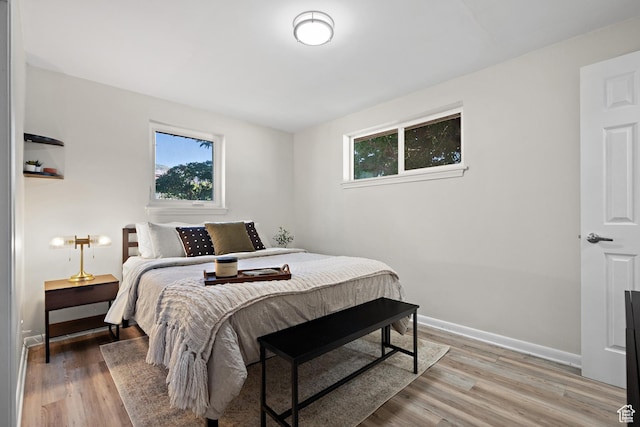251 E 1500 S, Orem, UT 84058 - bedroom featuring light wood-style flooring and baseboards