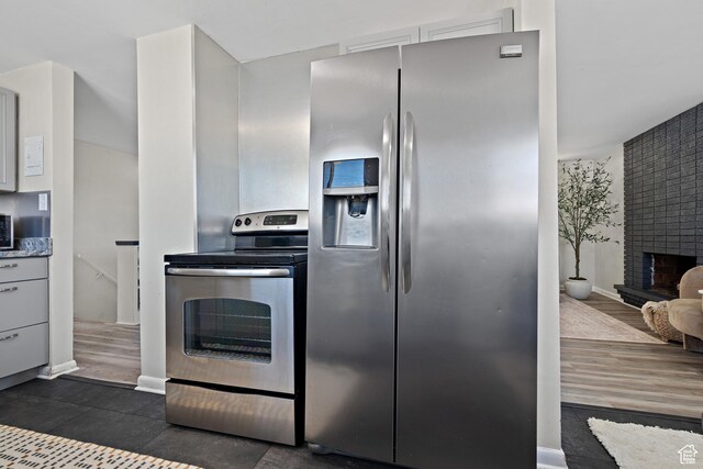 251 E 1500 S, Orem, UT 84058 - kitchen featuring stainless steel appliances and a fireplace