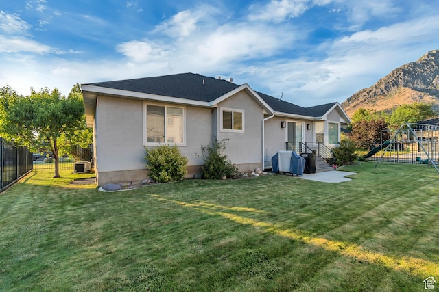 10768 N Fiddlesticks Lot 30, Cedar Hills, UT 84062 - back of house with a playground, stucco siding, and a mountain view
