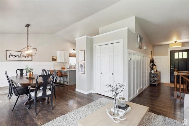 1184 Bridgecreek Ln, Layton, UT 84041 - dining space with vaulted ceiling, dark wood-style flooring, a chandelier, and healthy amount of natural light
