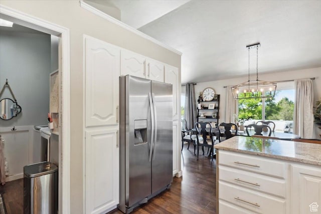 1184 Bridgecreek Ln, Layton, UT 84041 - kitchen with stainless steel fridge, white cabinetry, light stone counters, dark wood-style flooring, and decorative light fixtures