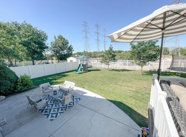 1184 Bridgecreek Ln, Layton, UT 84041 - fenced backyard featuring a patio, a trampoline, a playground, and outdoor dining space