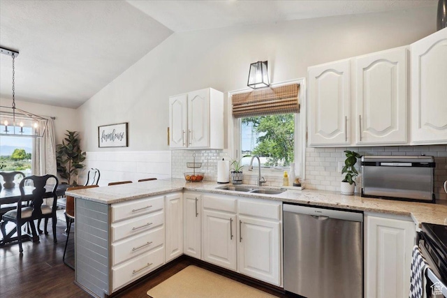 1184 Bridgecreek Ln, Layton, UT 84041 - kitchen with appliances with stainless steel finishes, lofted ceiling, a peninsula, white cabinetry, and dark wood finished floors