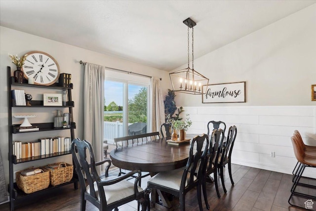1184 Bridgecreek Ln, Layton, UT 84041 - dining room with dark wood-type flooring, a chandelier, wainscoting, and lofted ceiling