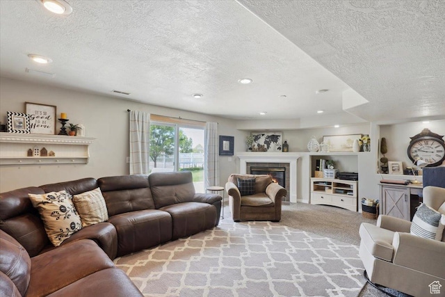 1184 Bridgecreek Ln, Layton, UT 84041 - living room featuring a textured ceiling, carpet floors, recessed lighting, and a fireplace
