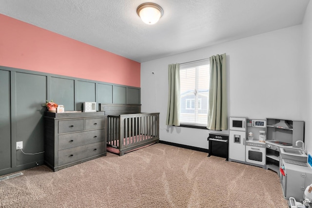 5631 W Still Well Ln S, Herriman, UT 84096 - carpeted bedroom featuring a textured ceiling, a decorative wall, and wainscoting
