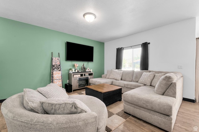 5631 W Still Well Ln S, Herriman, UT 84096 - living area with light wood-style floors and a fireplace